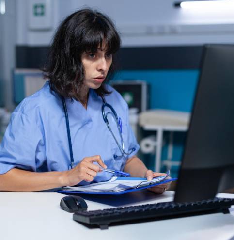 medical-assistant-analyzing-documents-files-monitor-night-nurse-looking-computer-working-healthcare-appointment-with-checkup-papers-doing-overtime-work-desk medical-assistant-analyzing-documents-files-monitor-night-nurse-looking-computer-working-healthcare-appointment-with-checkup-papers-doing-overtime-work-desk